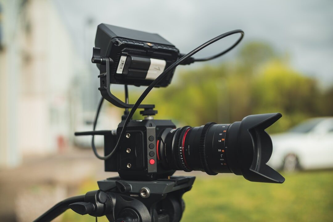 Video camera on a tripod filming a live outdoor report