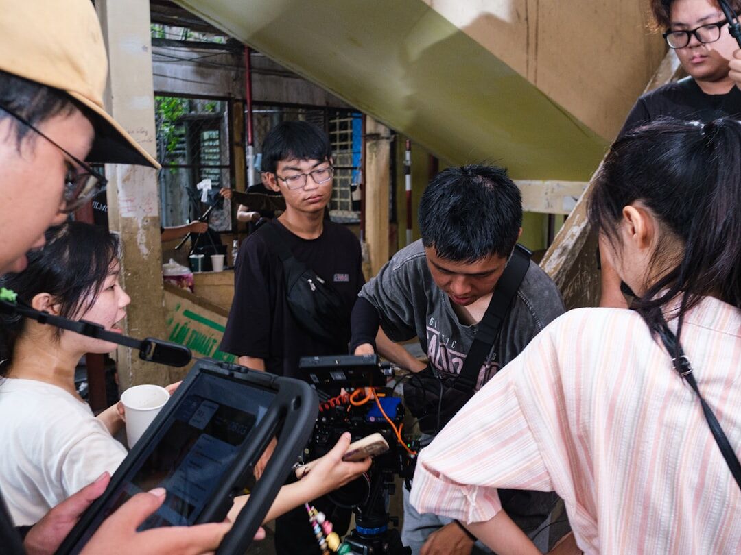 Group reviewing edited video footage on a monitor