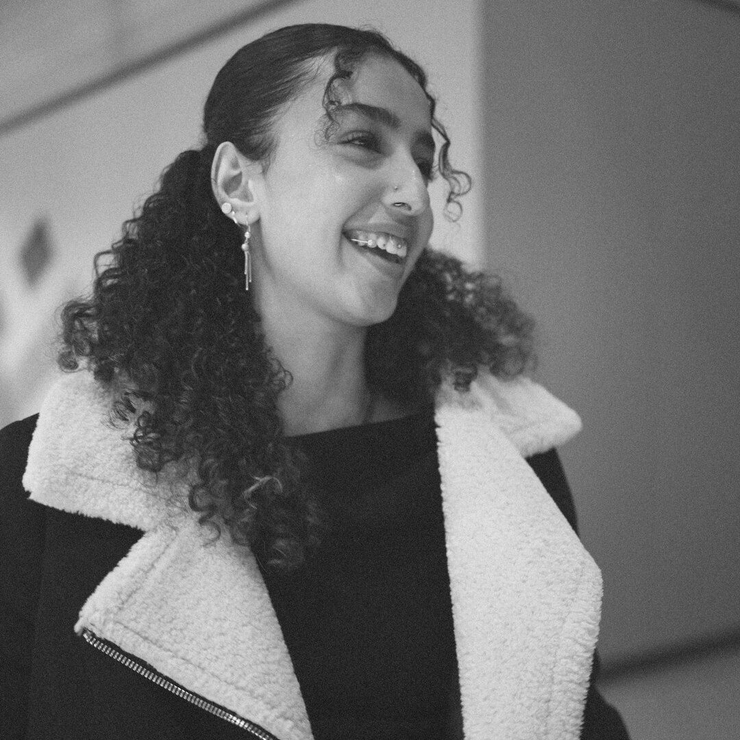 Portrait of a smiling woman with curly hair