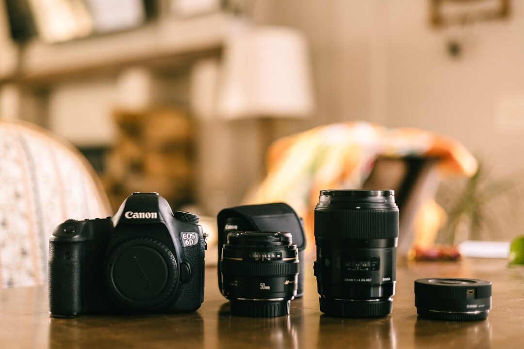 Close-up of professional camera lens and gear on a table